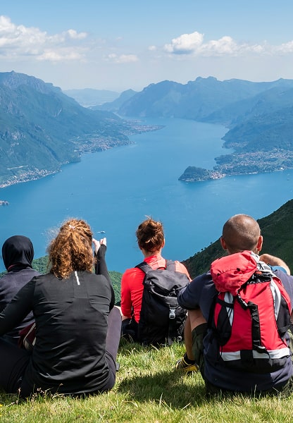 Couple toasting by the Lake Como on a cliff