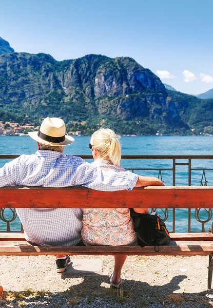 Couple on bench overlooking Lake Como